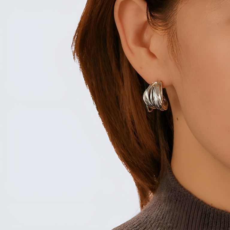 Crossover Huggie Earrings in Silver Tone